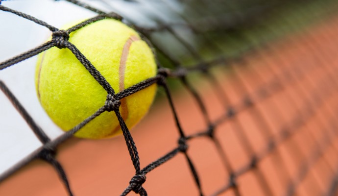 Tennis ball stuck on the net
