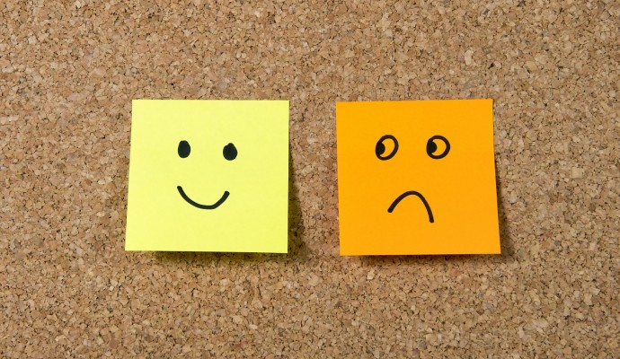 post it notes smiley and sad face happiness vs depression