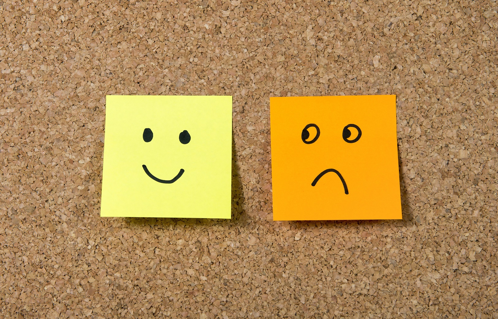 post it notes smiley and sad face happiness vs depression