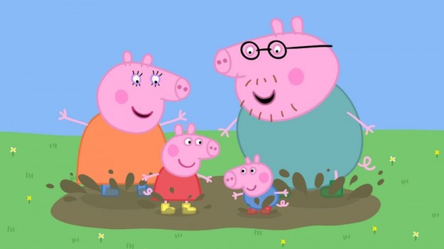 la-famiglia-pig-si-diverte-giocando-con-le-pozzanghere