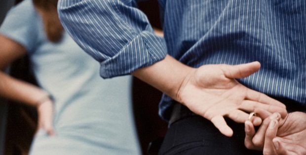 Man Removing Wedding Ring